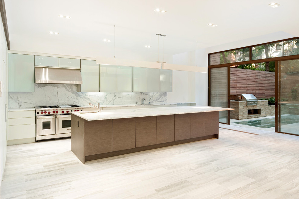 This is an example of a contemporary l-shaped kitchen in New York with flat-panel cabinets and stainless steel appliances.
