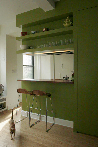 Example of a 1960s kitchen design in New York with wood countertops