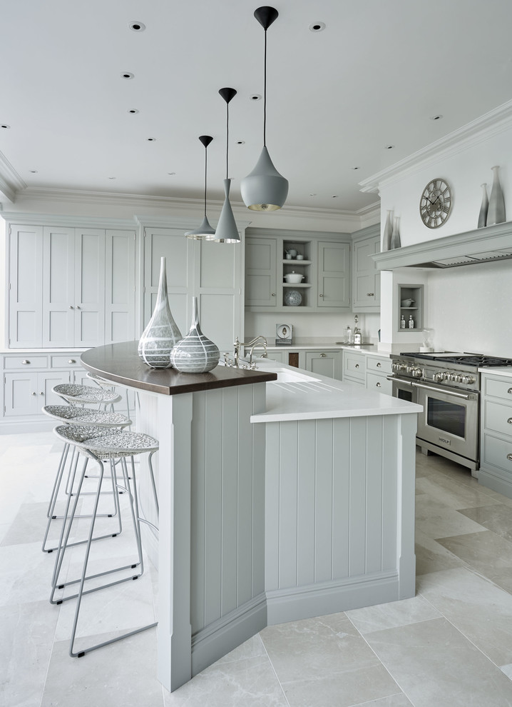 Design ideas for a large contemporary u-shaped kitchen/diner in Kent with a belfast sink, shaker cabinets, grey cabinets, quartz worktops, white splashback, stainless steel appliances, marble flooring, an island and beige floors.