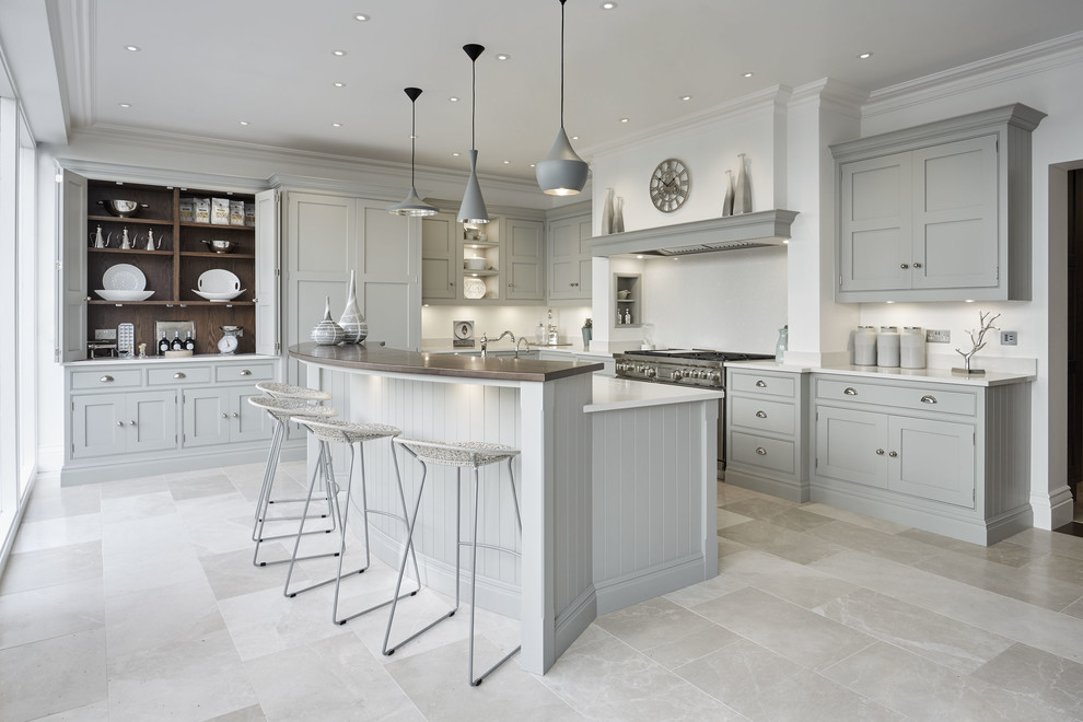 Inspiration for a large classic u-shaped kitchen/diner in Kent with a belfast sink, shaker cabinets, grey cabinets, quartz worktops, white splashback, stainless steel appliances, marble flooring, an island and beige floors.