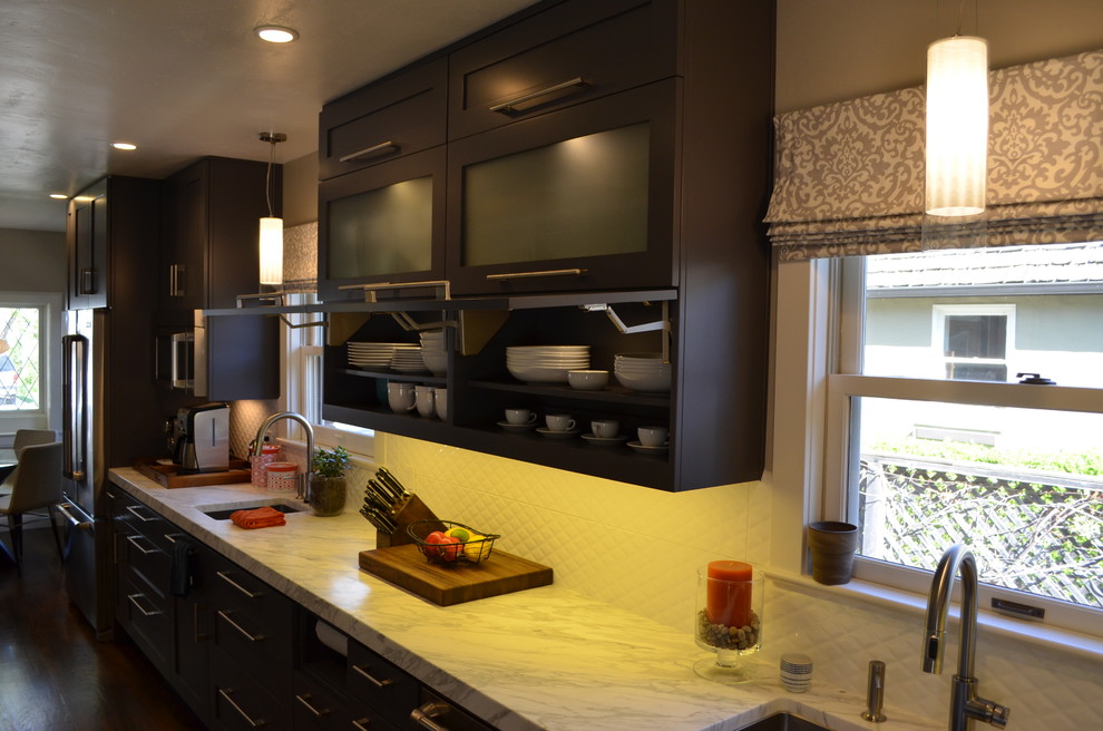 Large trendy dark wood floor kitchen photo in Sacramento with an undermount sink, shaker cabinets, gray cabinets, marble countertops, multicolored backsplash, glass tile backsplash, stainless steel appliances and no island