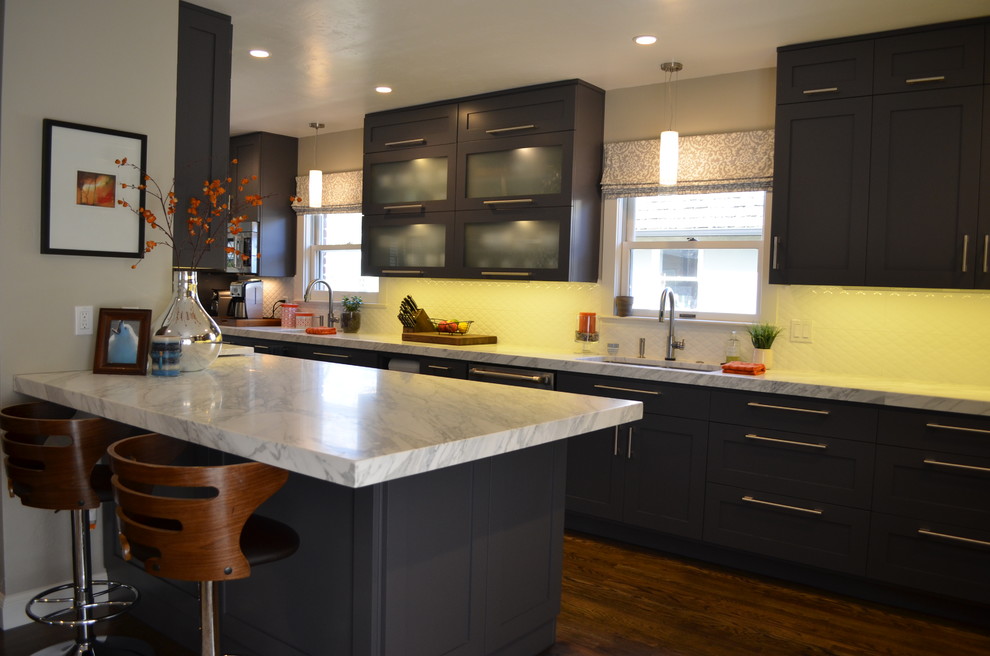 Inspiration for a large contemporary dark wood floor kitchen remodel in Sacramento with an undermount sink, shaker cabinets, gray cabinets, marble countertops, white backsplash, stainless steel appliances and no island