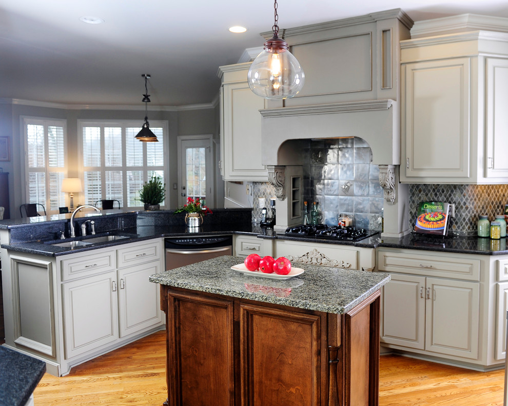 Kitchen - traditional kitchen idea in Nashville with raised-panel cabinets, gray cabinets and granite countertops