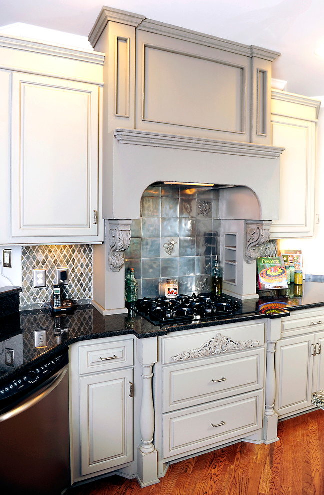 Kitchen - traditional kitchen idea in Nashville with raised-panel cabinets, gray cabinets and granite countertops