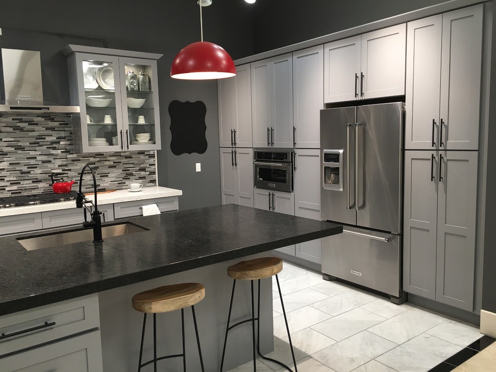 Enclosed kitchen - mid-sized contemporary single-wall porcelain tile and white floor enclosed kitchen idea in Orange County with shaker cabinets, gray cabinets, marble countertops, gray backsplash, matchstick tile backsplash, stainless steel appliances and an island