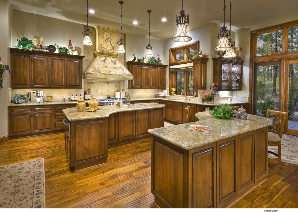 Example of a classic kitchen design in San Francisco with raised-panel cabinets, medium tone wood cabinets and beige backsplash