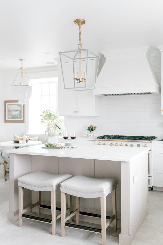 Inspiration for a transitional beige floor eat-in kitchen remodel in Baltimore with shaker cabinets, white cabinets, white backsplash, white appliances, an island and white countertops