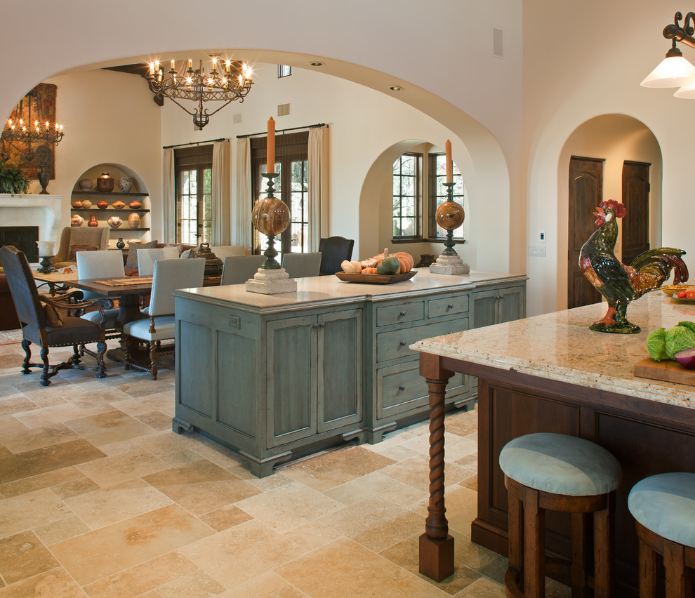 Inspiration for a huge timeless l-shaped limestone floor and beige floor open concept kitchen remodel in San Diego with granite countertops, a farmhouse sink, beige backsplash, recessed-panel cabinets, dark wood cabinets, ceramic backsplash, paneled appliances, two islands and beige countertops