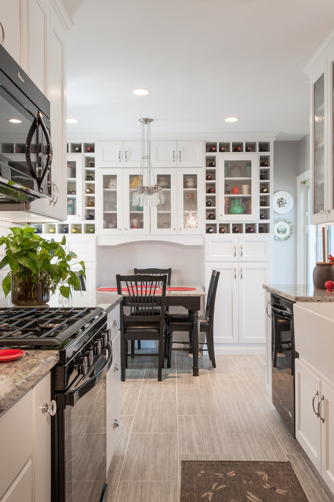 Eat-in kitchen - mid-sized transitional l-shaped porcelain tile eat-in kitchen idea in St Louis with an integrated sink, shaker cabinets, white cabinets, granite countertops, yellow backsplash, subway tile backsplash, colored appliances and no island