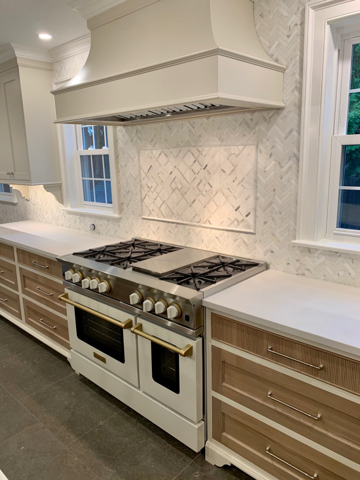Example of an eclectic limestone floor and blue floor kitchen design in Philadelphia with multicolored backsplash, marble backsplash, an island and gray countertops