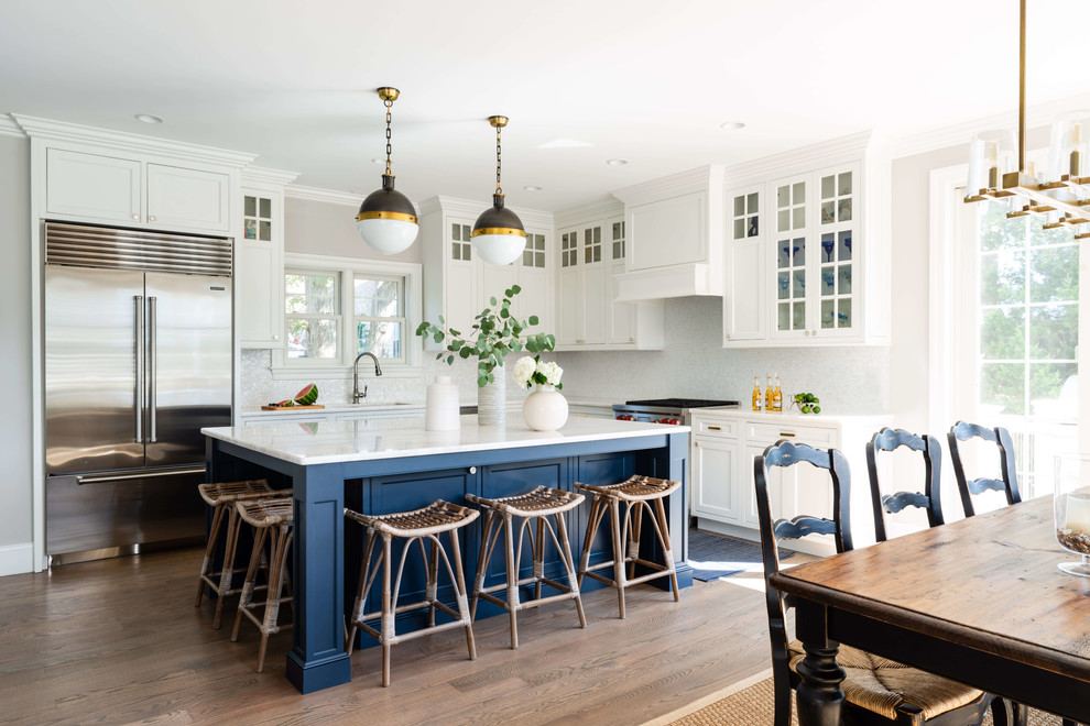 Inspiration for a l-shaped eat-in kitchen remodel in Providence with white cabinets, quartzite countertops, stainless steel appliances and an island