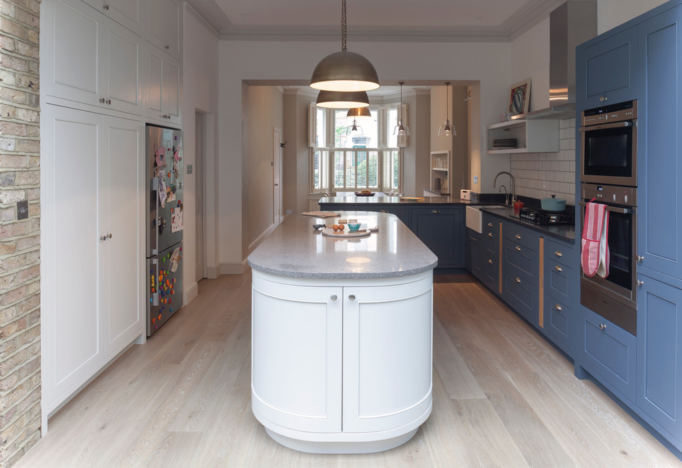 This is an example of a medium sized contemporary kitchen in London.