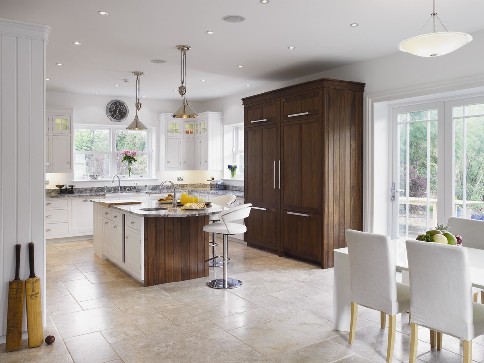 Transitional l-shaped limestone floor eat-in kitchen photo in London with granite countertops and an island