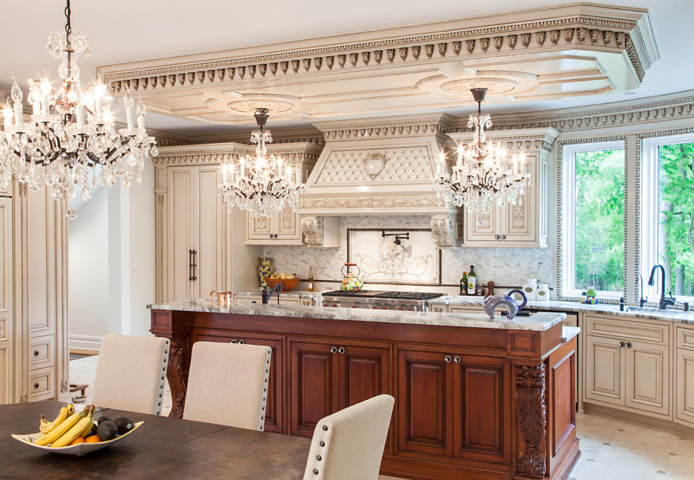 Large traditional u-shaped kitchen/diner in New York with a built-in sink, shaker cabinets, beige cabinets, engineered stone countertops, grey splashback, engineered quartz splashback, integrated appliances, an island, beige floors, beige worktops and a coffered ceiling.