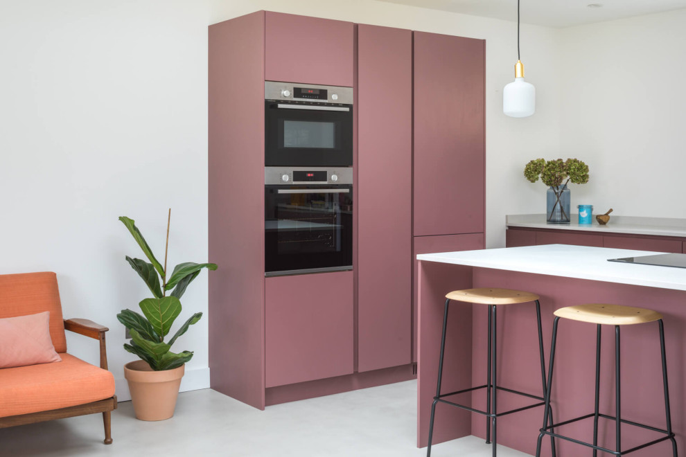 Medium sized contemporary l-shaped kitchen/diner in Other with flat-panel cabinets, purple cabinets, quartz worktops, white splashback, concrete flooring, an island, grey floors, white worktops and integrated appliances.