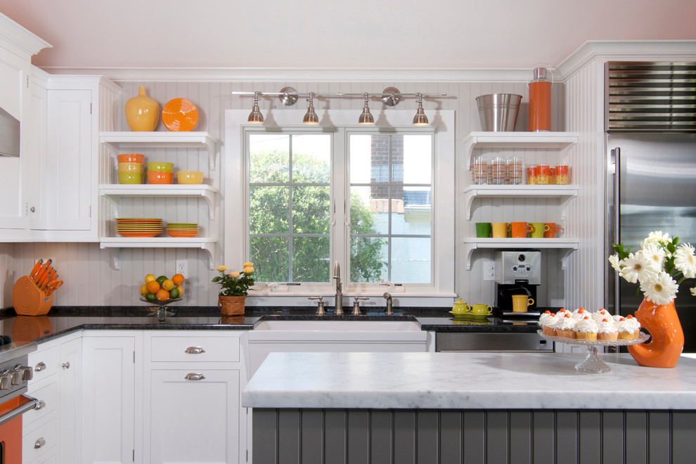 Transitional u-shaped ceramic tile eat-in kitchen photo in Other with a farmhouse sink, white cabinets, marble countertops, white backsplash, glass tile backsplash, colored appliances and a peninsula