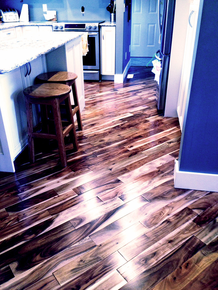 Photo of a traditional kitchen in Other with medium hardwood flooring.
