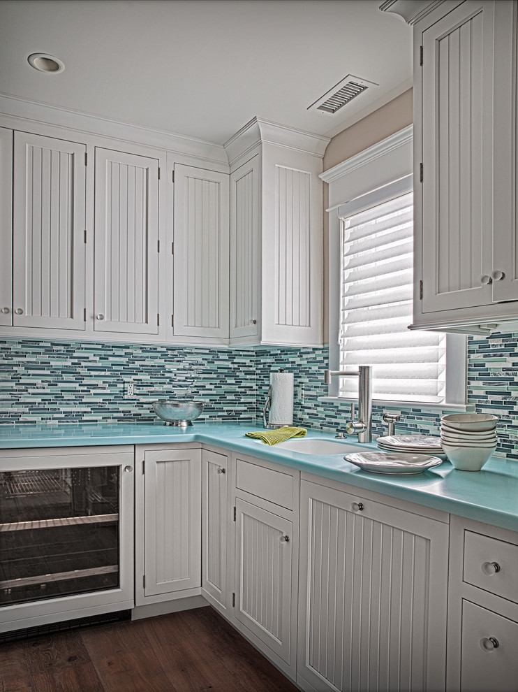 Inspiration for a nautical l-shaped kitchen/diner in Philadelphia with an integrated sink, beaded cabinets, white cabinets and mosaic tiled splashback.