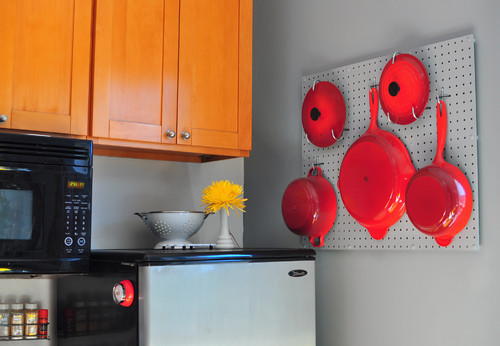 Cookware utensils hanging on wall