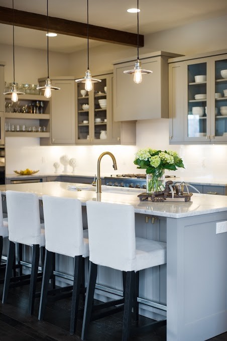 Inspiration for a mid-sized cottage dark wood floor open concept kitchen remodel in Boise with a farmhouse sink, shaker cabinets, gray cabinets, marble countertops, white backsplash, subway tile backsplash, stainless steel appliances and an island