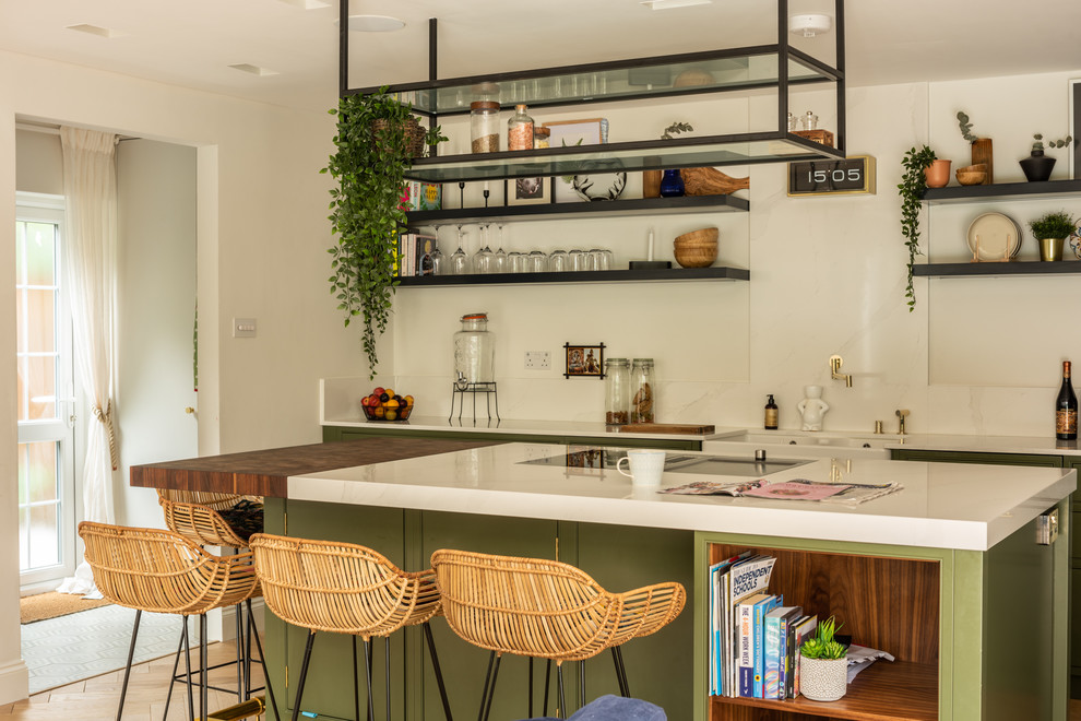 This is an example of a beach style kitchen in London.