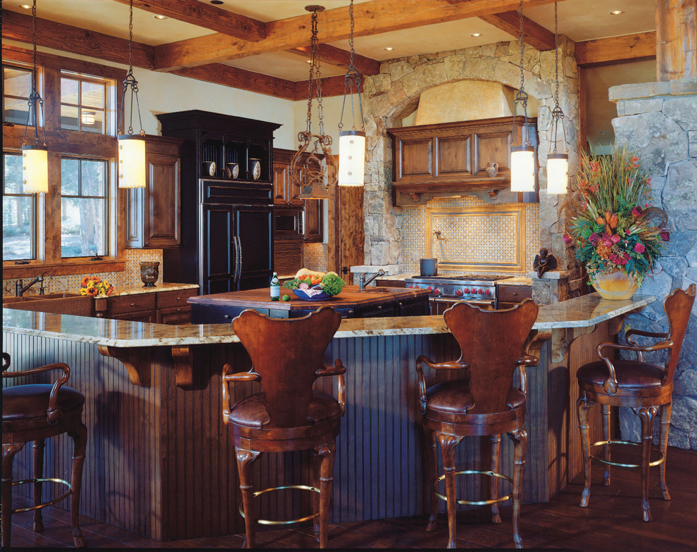 Inspiration for a rustic kitchen remodel in Denver with a farmhouse sink, raised-panel cabinets, dark wood cabinets, multicolored backsplash and paneled appliances