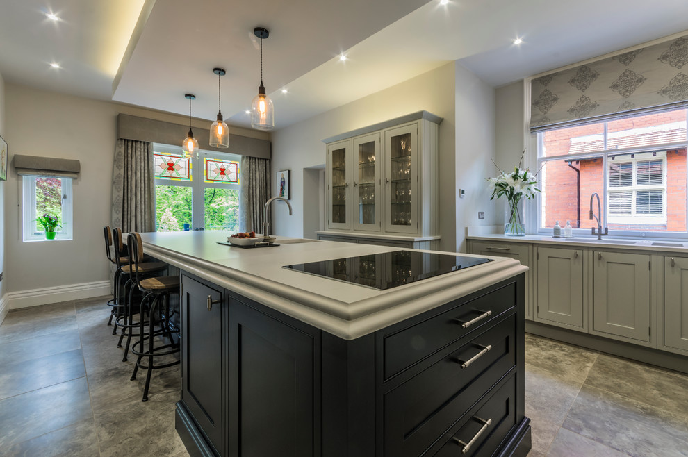 Mid-sized trendy eat-in kitchen photo in Cheshire with raised-panel cabinets, gray cabinets, marble countertops and an island