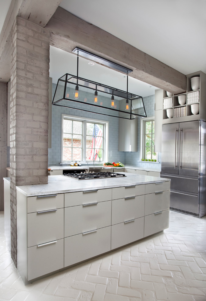 Inspiration for a contemporary l-shaped brick floor kitchen remodel in New Orleans with flat-panel cabinets, white cabinets, blue backsplash and an island