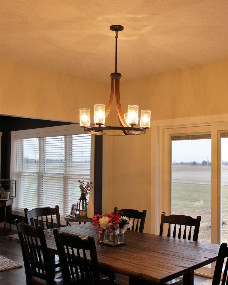 Photo of a medium sized rustic open plan dining room in Other with medium hardwood flooring and brown floors.