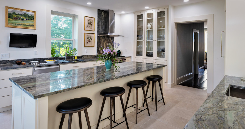Inspiration for a large transitional galley limestone floor and beige floor kitchen remodel in Philadelphia with an undermount sink, white cabinets, granite countertops, an island, green countertops, recessed-panel cabinets and stainless steel appliances