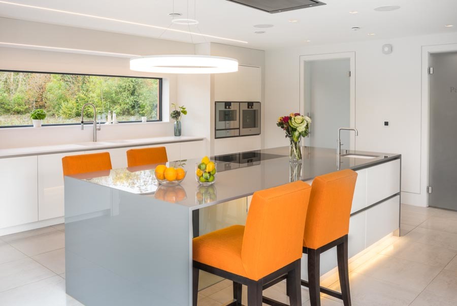 Large contemporary open plan kitchen in Oxfordshire with an island.
