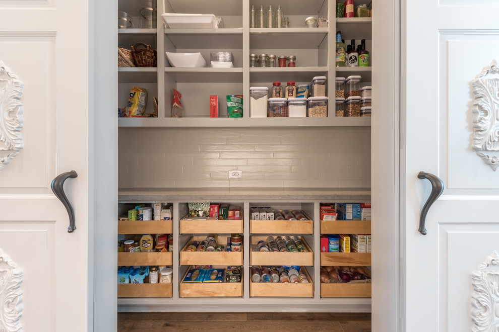 This is an example of a large classic l-shaped kitchen pantry in Houston with open cabinets, grey cabinets, dark hardwood flooring and brown floors.
