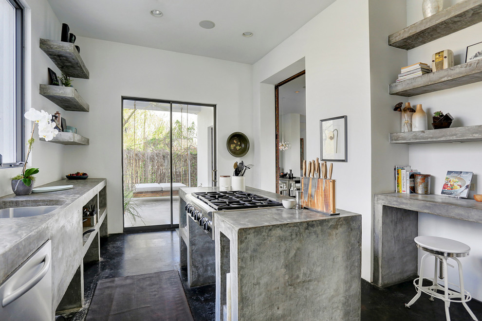 Medium sized enclosed kitchen in Houston with a submerged sink, open cabinets, grey cabinets, concrete worktops, stainless steel appliances, concrete flooring and an island.
