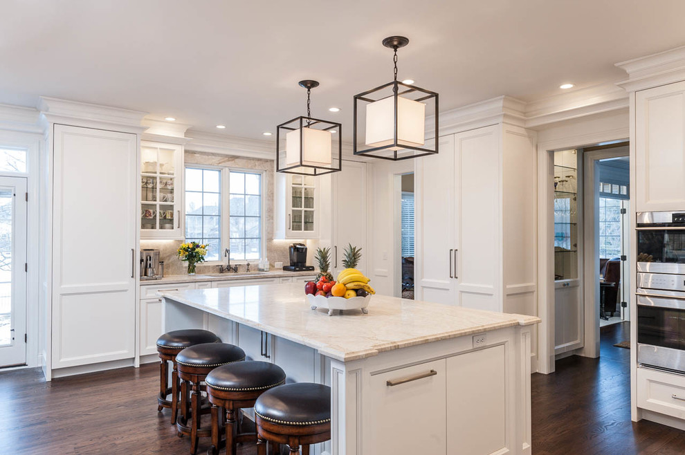 Example of a large transitional u-shaped medium tone wood floor eat-in kitchen design in Indianapolis with an undermount sink, white cabinets, onyx countertops, multicolored backsplash, stone slab backsplash, stainless steel appliances and an island