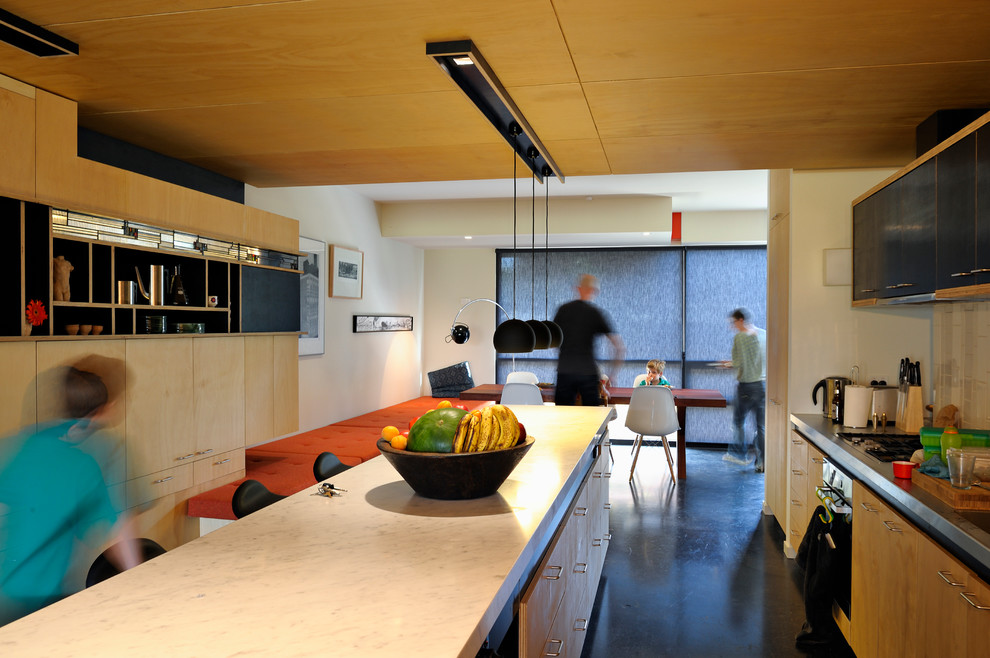 Inspiration for a contemporary kitchen in Melbourne with an island.