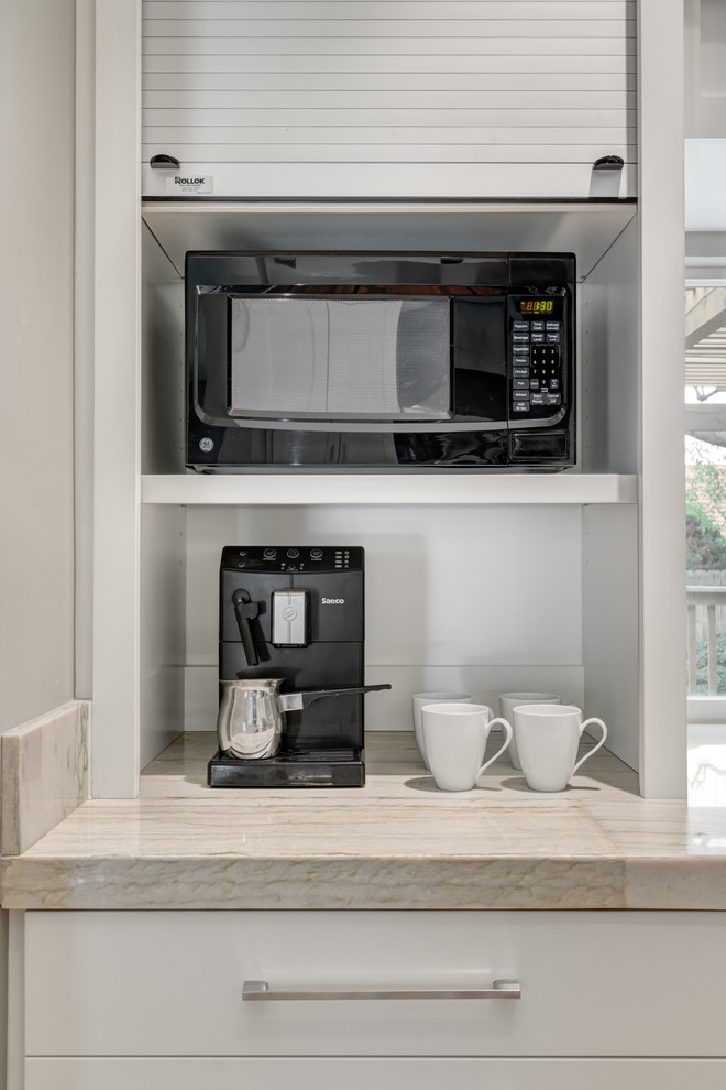 Mid-sized transitional galley medium tone wood floor eat-in kitchen photo in San Diego with an undermount sink, shaker cabinets, white cabinets, quartzite countertops, blue backsplash, porcelain backsplash, stainless steel appliances and no island