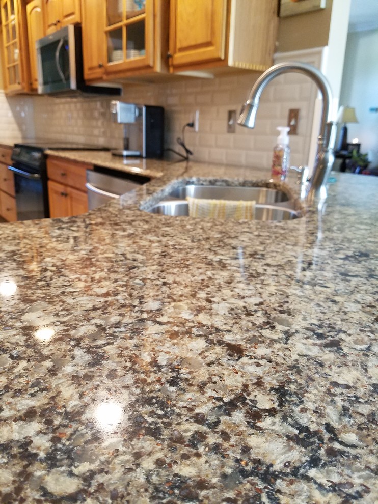 Elegant kitchen photo in Other with a double-bowl sink, quartz countertops, white backsplash and ceramic backsplash