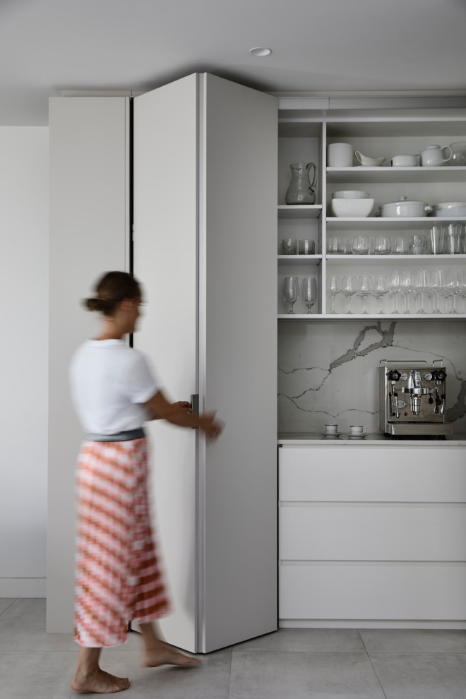 Photo of a contemporary kitchen pantry in Melbourne.