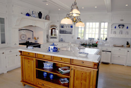 Example of a large light wood floor eat-in kitchen design in Bridgeport with a drop-in sink, white cabinets, marble countertops, white backsplash, subway tile backsplash and an island