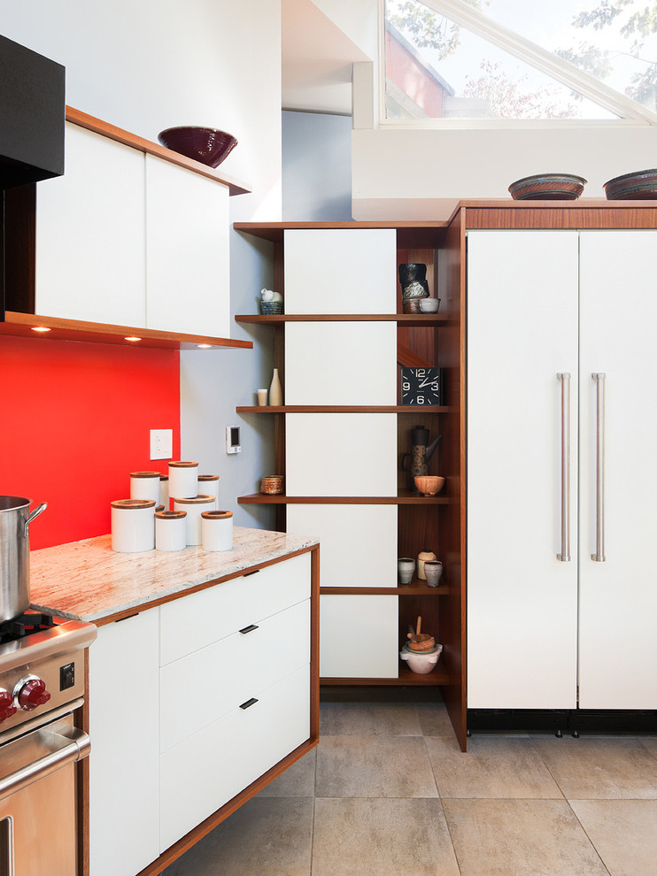 This is an example of a medium sized midcentury galley open plan kitchen in Philadelphia with a built-in sink, flat-panel cabinets, white cabinets, wood worktops, beige splashback, stone tiled splashback, stainless steel appliances, ceramic flooring and an island.