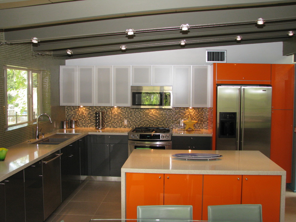 Example of a mid-sized minimalist l-shaped porcelain tile open concept kitchen design in Phoenix with a double-bowl sink, flat-panel cabinets, quartz countertops, multicolored backsplash, glass tile backsplash, stainless steel appliances and an island
