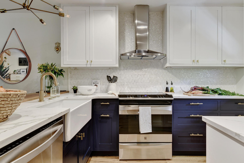 Example of a small classic l-shaped light wood floor and beige floor eat-in kitchen design in Austin with a farmhouse sink, shaker cabinets, blue cabinets, quartzite countertops, white backsplash, mosaic tile backsplash, stainless steel appliances and a peninsula