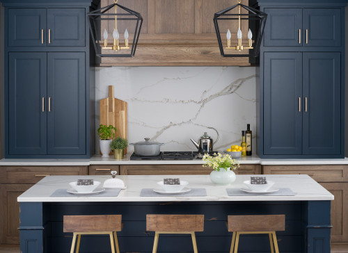 These Sherwin Williams Gale Force kitchen cabinets are spectacular paired with walnut colored hood and lower cabinets + marble backsplash