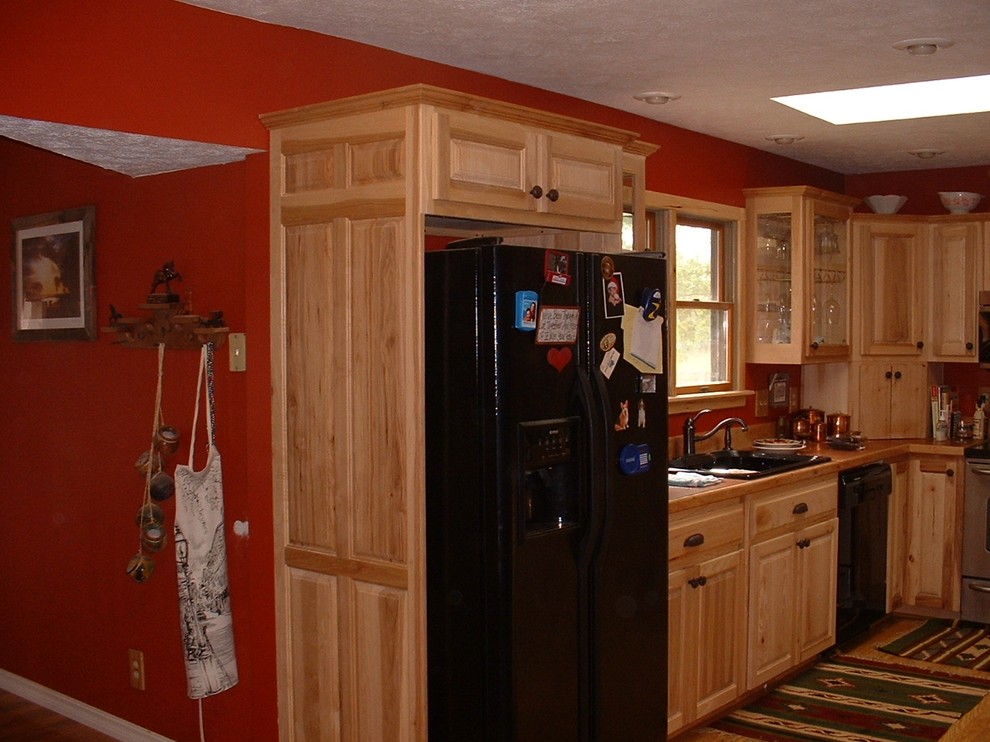 Example of a large classic light wood floor kitchen pantry design in St Louis with a double-bowl sink, raised-panel cabinets, light wood cabinets and tile countertops