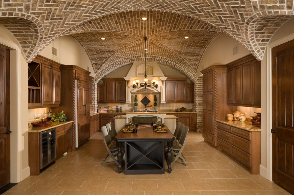 Large elegant u-shaped porcelain tile enclosed kitchen photo in Houston with raised-panel cabinets, dark wood cabinets, granite countertops, beige backsplash, paneled appliances and an island