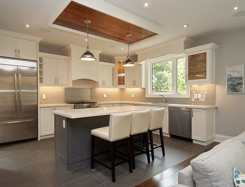 Open concept kitchen - mid-sized contemporary l-shaped marble floor open concept kitchen idea in Toronto with an undermount sink, shaker cabinets, white cabinets, quartz countertops, white backsplash, ceramic backsplash, stainless steel appliances and an island