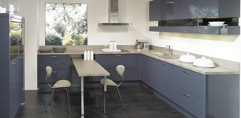 Medium sized contemporary l-shaped kitchen/diner in Other with a single-bowl sink, flat-panel cabinets, blue cabinets, laminate countertops, integrated appliances, lino flooring and an island.