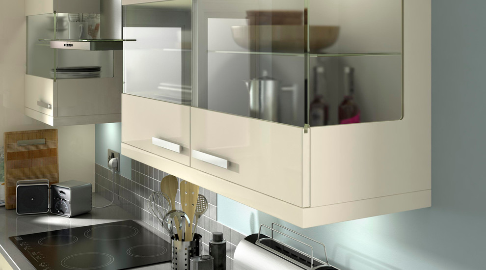 Design ideas for a contemporary kitchen in Hampshire with flat-panel cabinets, white cabinets and wood worktops.
