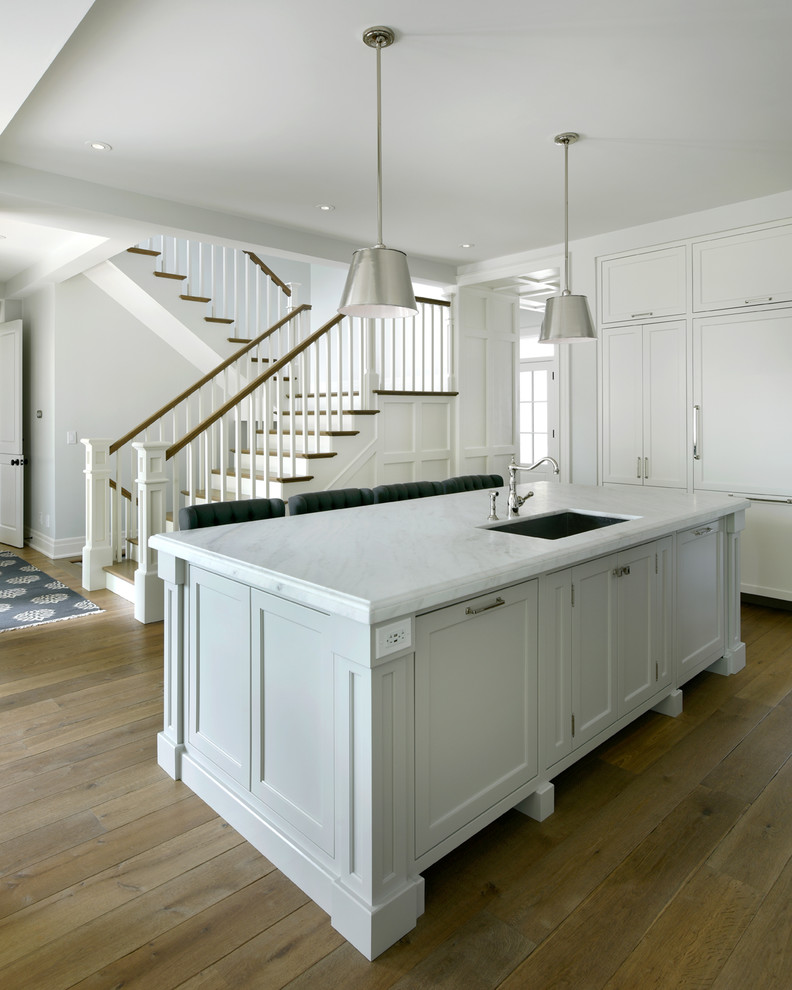 Elegant medium tone wood floor kitchen photo in Ottawa