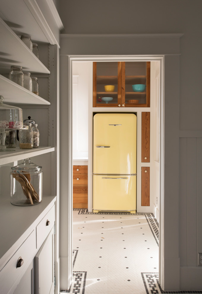 Inspiration for an eclectic kitchen remodel in Austin with colored appliances and medium tone wood cabinets